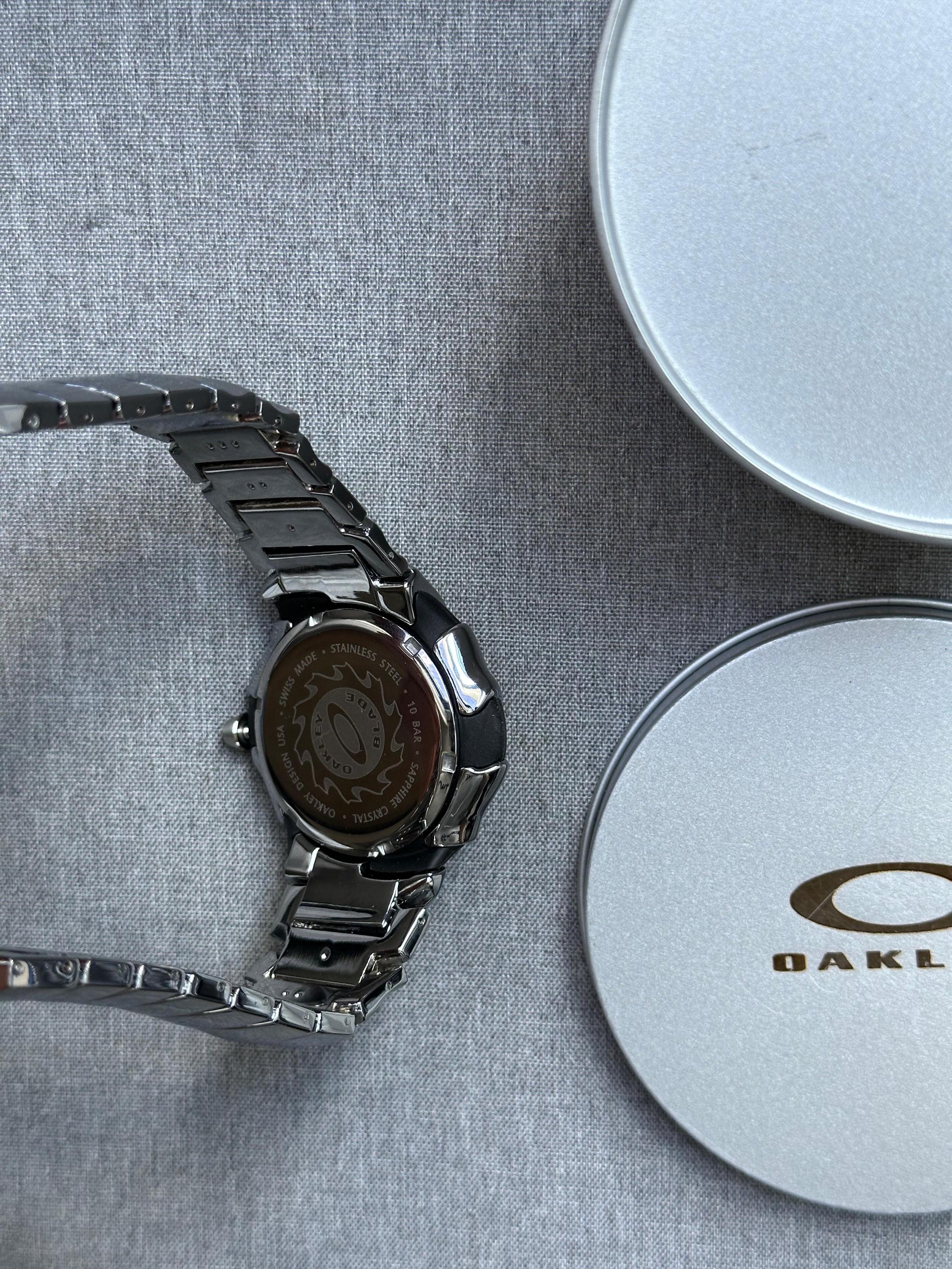 Oakley Blade Watch – White Dial Silver SHINY Stainless Steel with Smooth Reflective Strap, Swiss Movement, Collectible Men’s Watch